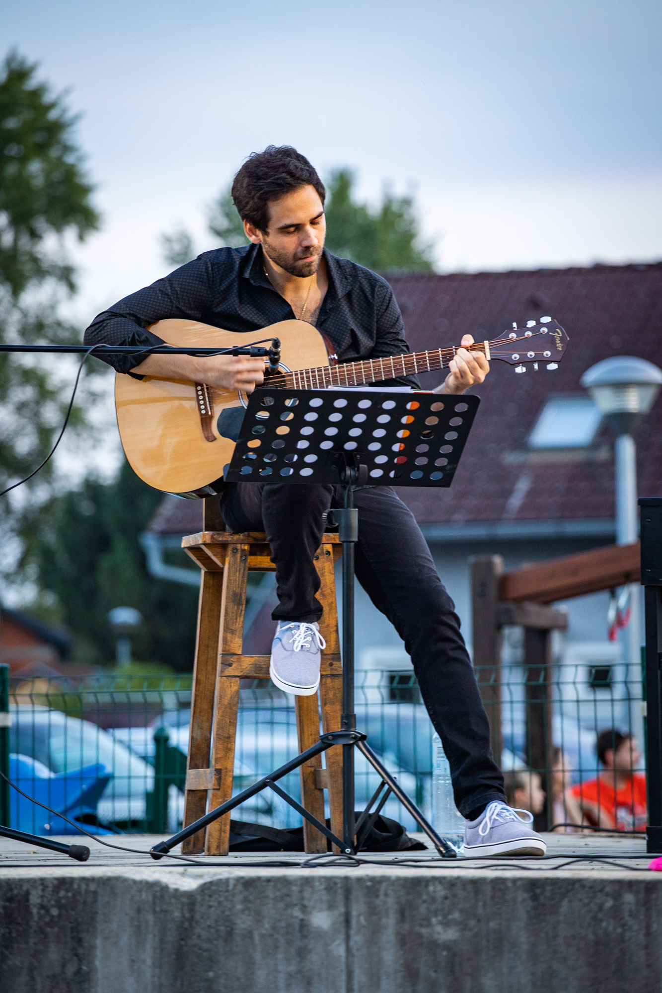 LUPO performing acoustic guitar